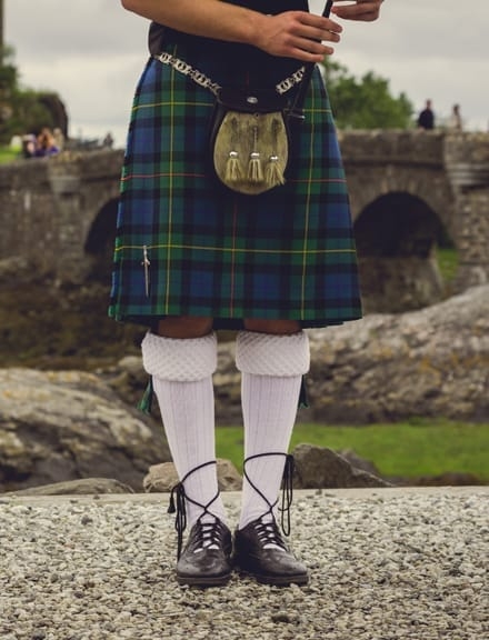 Bagpiper's legs at traditional dress