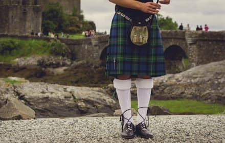 Bagpiper's legs at traditional dress
