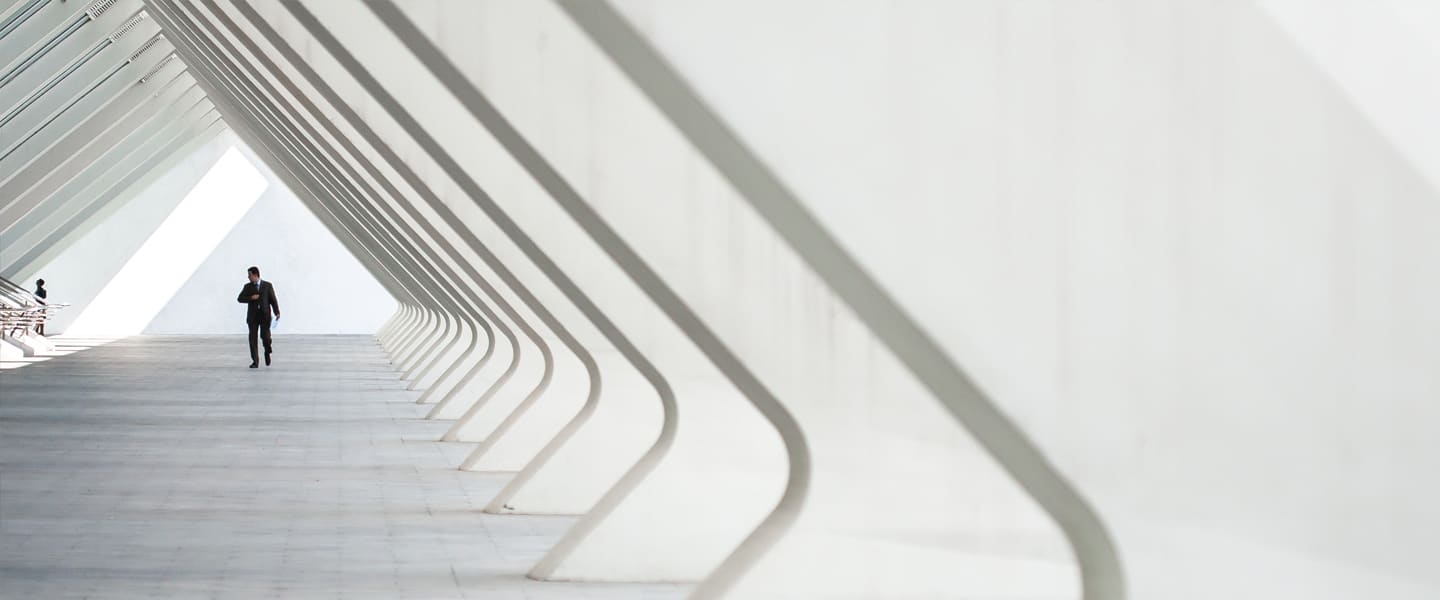 man in a bright corridor in a modern building