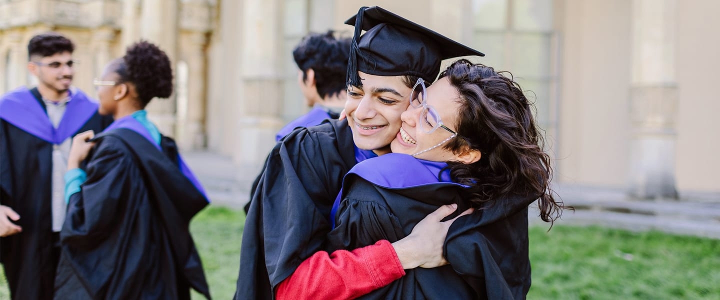 students celebrating graduation